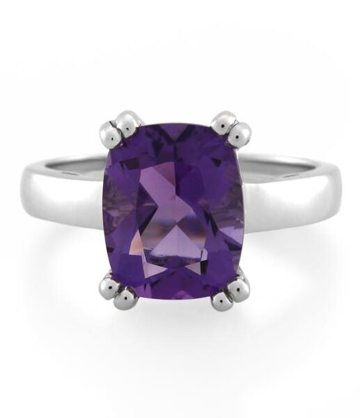 An amethyst ring in a solitaire setting in white gold ring band