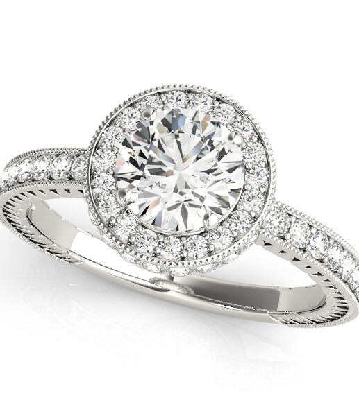 White gold channel set round cut diamond ring with milgrain design surrounding the halo and upper shank