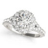 White gold round cut engagement ring in a halo setting with set of diamonds on upper shank