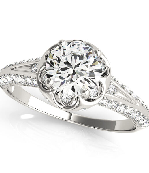 top view of a white gold diamond halo engagement ring with a number of side and accent stones