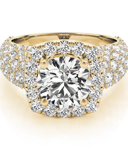 a thick band yellow gold diamond halo engagement ring surrounded by smaller diamonds also on each shoulder