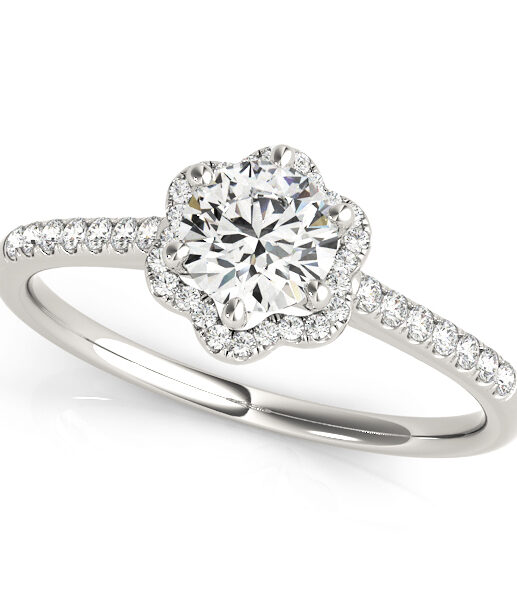 top view of a petite white gold diamond halo engagement ring gripped by 6 white gold prongs surrounded by smaller diamonds on each side of the shoulder