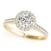 top view of a petite yellow gold halo engagement ring with a round diamond gripped by 4 prongs surrounded in smaller diamonds