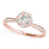 Top view of rose gold round cut diamond ring with heart shaped prongs and intricate design on band