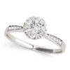 White gold diamond with heart shape prongs and channel set of diamonds on upper shank