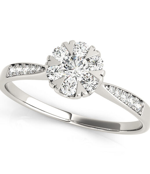 White gold diamond with heart shape prongs and channel set of diamonds on upper shank