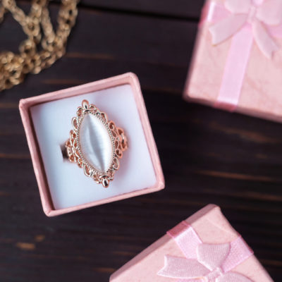Sample of vintage engagement rings, a marquise cut placed in a pink ring box