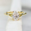 Custom Trilogy Engagement Ring with Yellow Gold Band & Oval Cut Diamond with Round Cut Yellow Sapphire Side Stones