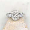 Custom Trilogy Engagement Ring with Platinum Band & Oval Cut Diamond with Round Cut Diamond Side Stones