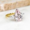 Custom Trilogy Engagement Ring with Yellow & White Gold Band and Pear Cut Morganite & Diamond Trilogy